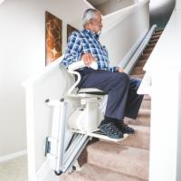 Person Riding Up the Stairs